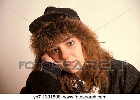 Close up studio portrait of teenage girl looking a little bored View Large Photo Image Stock Photo - Close up studio portrait of teenage girl looking a little bored. Fotosearch