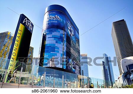 Stock Image - Close Up View of the City Center Complex on the Strip, Las Vegas, NV, USA, People Crossing Las Vegas Boulevard on a Pedestrian Overpass, Walking into the Complex.. Fotosearch