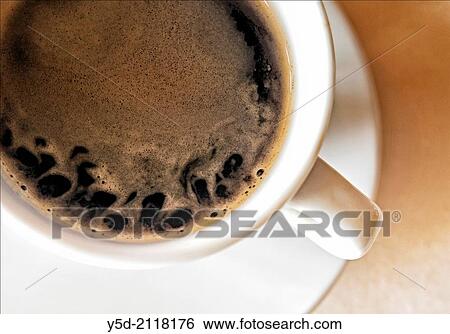Close-up white cup with coffee taken directly above View Large Photo Image Stock Photograph - Close-up white cup with coffee taken directly above. Fotosearch