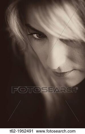 Stock Image - Close-up young woman beautiful face. Monochrome.. Fotosearch
