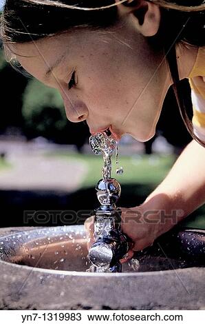 close view of gorl sipping water from a drink fountain View Large Photo Image Stock Image - close view of gorl sipping water from a drink fountain. Fotosearch