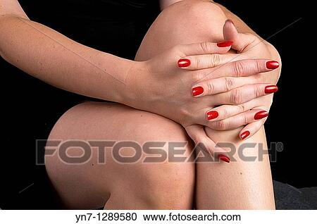 close view of woman's hands folded across knees View Large Photo Image Stock Image - close view of woman's hands folded across knees. Fotosearch