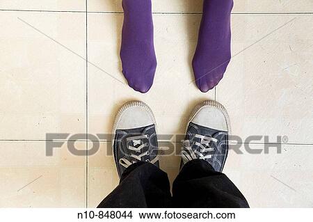 Close_up of a young woman's and man's feet. View Large Photo Image Picture - Close_up of a young woman's and man's feet.. Fotosearch