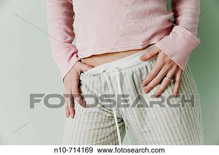 Close_up of a young woman's midsection. View Large Photo Image Stock Photo - Close_up of a young woman's midsection.. Fotosearch