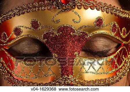Closed eyes of a woman behind a venetian mask View Large Photo Image Stock Photo - Closed eyes of a woman behind a venetian mask. Fotosearch