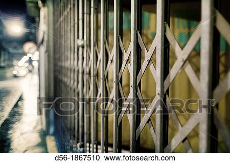 Stock Image - Closed shop at night, Ubeda, Jaen province, Andalusia, Spain. Fotosearch