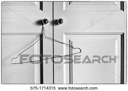 Closet doors closed with empty hanger, View Large Photo Image Stock Photography - Closet doors closed with empty hanger,. Fotosearch