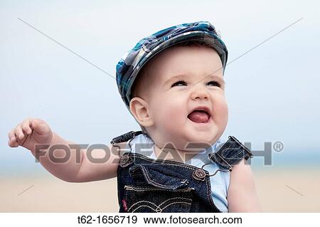 Closeup of a baby laughing and playing View Large Photo Image Stock Photo - Closeup of a baby laughing and playing. Fotosearch