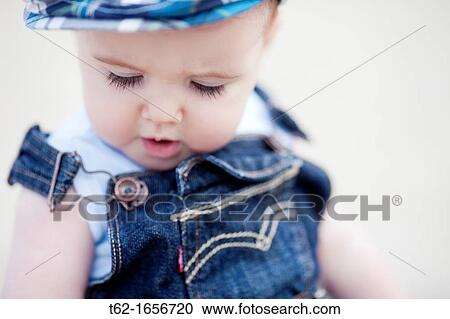 Closeup of a baby playing alone View Large Photo Image Stock Image - Closeup of a baby playing alone. Fotosearch