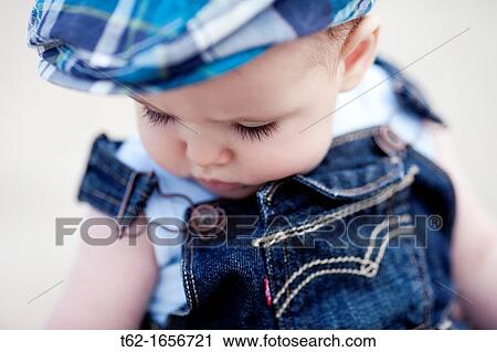 Closeup of a baby playing alone View Large Photo Image Stock Image - Closeup of a baby playing alone. Fotosearch