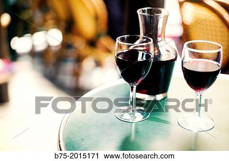 closeup of a bar table with a traditional bottle and two glasses of wine Beaujolais in Paris, France View Large Photo Image Stock Image - closeup of a bar table with a traditional bottle and two glasses of wine Beaujolais in Paris, France. Fotosearch