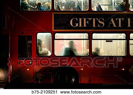 Closeup of a Double deker bus, at night with people inside. London, England, UK, Europe View Large Photo Image Stock Image - Closeup of a Double deker bus, at night with people inside. London, England, UK, Europe. Fotosearch