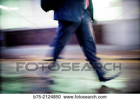 closeup of a executive walking harriedly down the street in London, England, UK, Europe. View Large Photo Image Stock Image - closeup of a executive walking harriedly down the street in London, England, UK, Europe.. Fotosearch