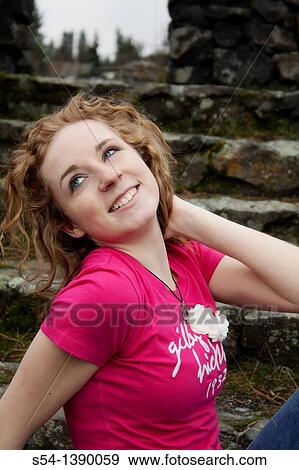 Closeup of a happy young woman outdoors. View Large Photo Image Stock Photo - Closeup of a happy young woman outdoors.. Fotosearch