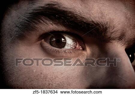 Picture - Closeup of a man's eye. Fotosearch