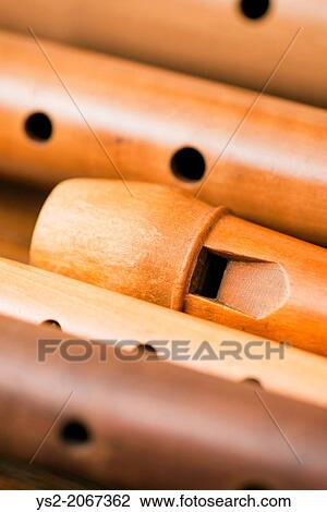 Closeup of a variety of wooden flutes. View Large Photo Image Stock Image - Closeup of a variety of wooden flutes.. Fotosearch
