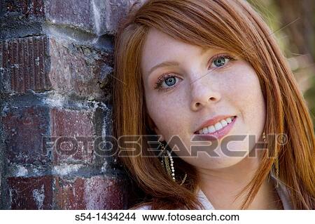 Closeup of a young woman outdoors. View Large Photo Image Picture - Closeup of a young woman outdoors.. Fotosearch