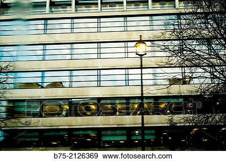 Closeup of an apartment building with a lighted lamp post in London, England, UK, Europe. View Large Photo Image Stock Photo - Closeup of an apartment building with a lighted lamp post in London, England, UK, Europe.. Fotosearch