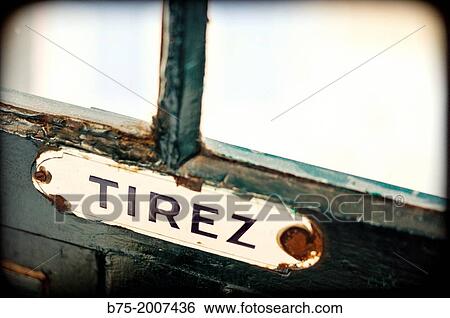closeup of an old sign on a door that puts Tirez, Paris View Large Photo Image Stock Photograph - closeup of an old sign on a door that puts Tirez, Paris. Fotosearch