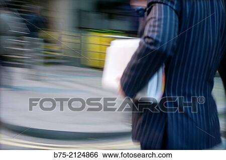 Closeup of an unrecognizable executive with portfolio walking down the street, London, England, UK, Europe. View Large Photo Image Stock Photograph - Closeup of an unrecognizable executive with portfolio walking down the street, London, England, UK, Europe.. Fotosearch