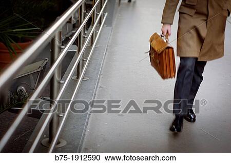 closeup of businessman with portfolio walking down the street, Leadenhall, City of London, England, UK View Large Photo Image Stock Image - closeup of businessman with portfolio walking down the street, Leadenhall, City of London, England, UK. Fotosearch