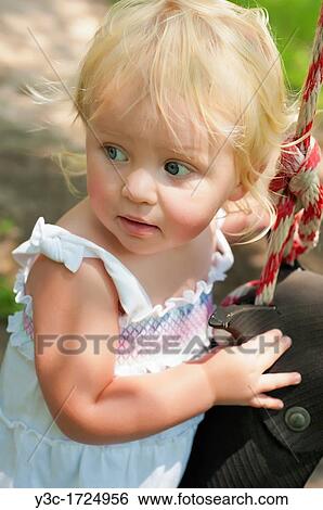 Closeup of female toddler between one and two years old View Large Photo Image Stock Photograph - Closeup of female toddler between one and two years old. Fotosearch