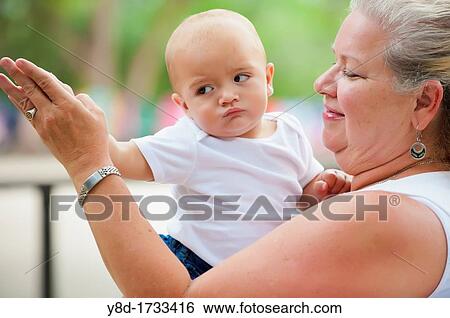 Closeup of grandmother dancing with her baby grandchild View Large Photo Image Stock Photograph - Closeup of grandmother dancing with her baby grandchild. Fotosearch