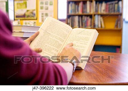 Closeup of hand pointing to writing in a book View Large Photo Image Stock Image - Closeup of hand pointing to writing in a book. Fotosearch