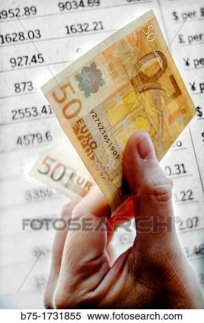 closeup of hand with 50 euro note on fund money market listing View Large Photo Image Stock Photography - closeup of hand with 50 euro note on fund money market listing. Fotosearch
