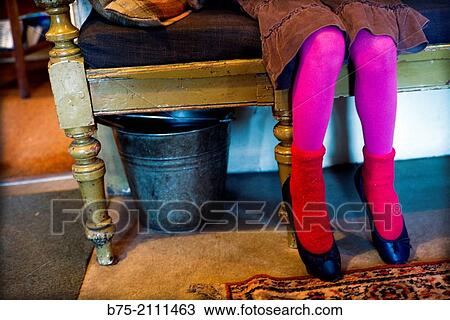 Closeup of legs of a girl with fuchsia colored stockings and red socks, sitting on a wooden bench. England, UK, Europe. View Large Photo Image Stock Image - Closeup of legs of a girl with fuchsia colored stockings and red socks, sitting on a wooden bench. England, UK, Europe.. Fotosearch