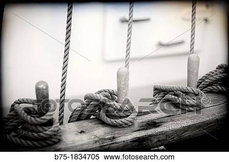 Closeup of old sailboat deck with ropes tied View Large Photo Image Stock Photography - Closeup of old sailboat deck with ropes tied. Fotosearch