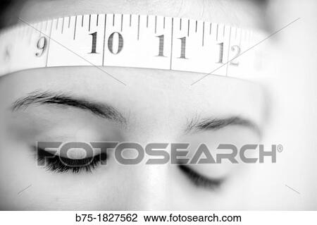 Closeup of teenage girl with tape measure round the front View Large Photo Image Stock Image - Closeup of teenage girl with tape measure round the front. Fotosearch