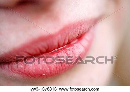 Stock Image - Closeup of the face - Portrait of beautiful woman outdoors. Fotosearch