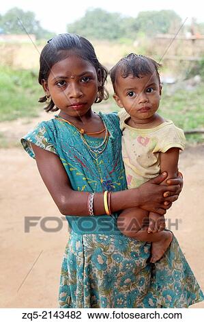 Stock Image - Closeup of tribal children. Santhal tribe. Jarweadhi village, Bishangarh block, District Hazaribaug, Jharkhand.. Fotosearch