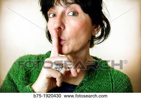 Closeup of woman with silence gesture View Large Photo Image Stock Image - Closeup of woman with silence gesture. Fotosearch