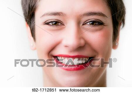 Stock Image - closeup of young woman smiling on white background. Fotosearch