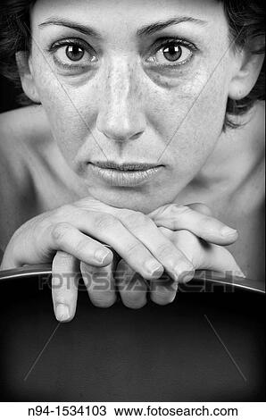 Closeup of young woman, with his chin on his hands and looking at the camera. View Large Photo Image Stock Image - Closeup of young woman, with his chin on his hands and looking at the camera.. Fotosearch