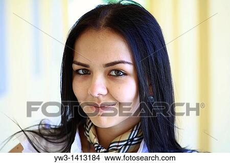 Closeup portrait of a beautiful 20-25 years happy woman in blur background outdoors View Large Photo Image Picture - Closeup portrait of a beautiful 20-25 years happy woman in blur background outdoors. Fotosearch