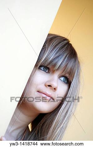 Picture - Closeup portrait of a beautiful 20-25 years woman outdoors with blank expression. Fotosearch