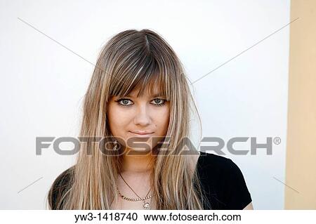Closeup portrait of a beautiful 20-25 years woman outdoors with blank expression View Large Photo Image Stock Image - Closeup portrait of a beautiful 20-25 years woman outdoors with blank expression. Fotosearch