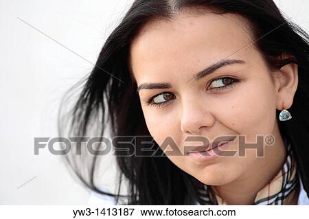 Closeup portrait of a beautiful 20-25 years happy woman in blur background outdoors View Large Photo Image Stock Photo - Closeup portrait of a beautiful 20-25 years happy woman in blur background outdoors. Fotosearch