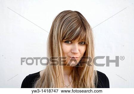 Stock Photo - Closeup portrait of a beautiful 20-25 years happy woman outdoors. Fotosearch