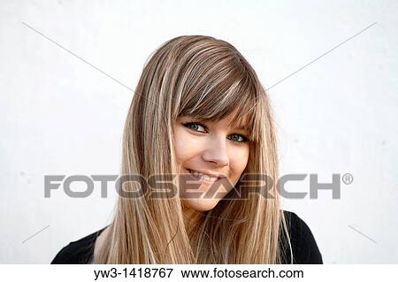 Stock Photo - Closeup portrait of a beautiful 20-25 years happy woman outdoors. Fotosearch