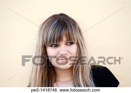 Stock Photograph - Closeup portrait of a beautiful 20-25 years happy woman outdoors. Fotosearch