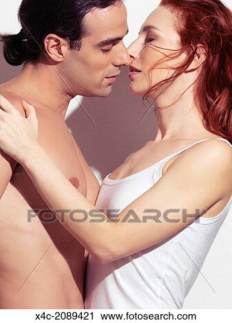 Closeup Portrait Of A Sexy Couple Kissing Young Man With Bare