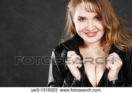 Stock Image - closeup portrait of a young adult woman smiling. Fotosearch