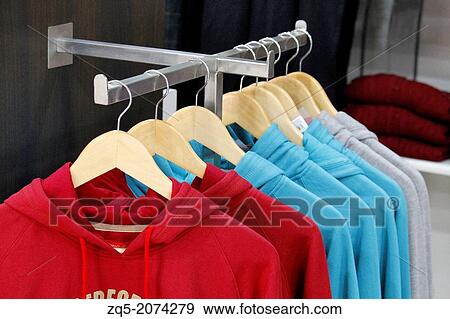 Clothes Hanger With Colourful T-Shirt, Himachal Pradesh, India. View Large Photo Image Stock Photo - Clothes Hanger With Colourful T-Shirt, Himachal Pradesh, India.. Fotosearch