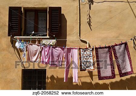 Clothes hung out to dry in San Gimignano in Tuscany, Italy. View Large Photo Image Stock Image - Clothes hung out to dry in San Gimignano in Tuscany, Italy.. Fotosearch