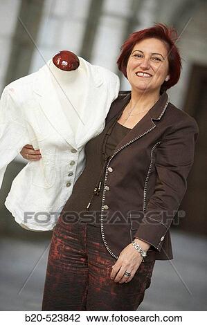 Stock Image - Clothes seller with a mannequin. Retailers association. Elgoibar, Gipuzkoa, Euskadi. Spain.. Fotosearch