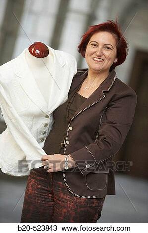 Stock Image - Clothes seller with a mannequin. Retailers association. Elgoibar, Gipuzkoa, Euskadi. Spain.. Fotosearch